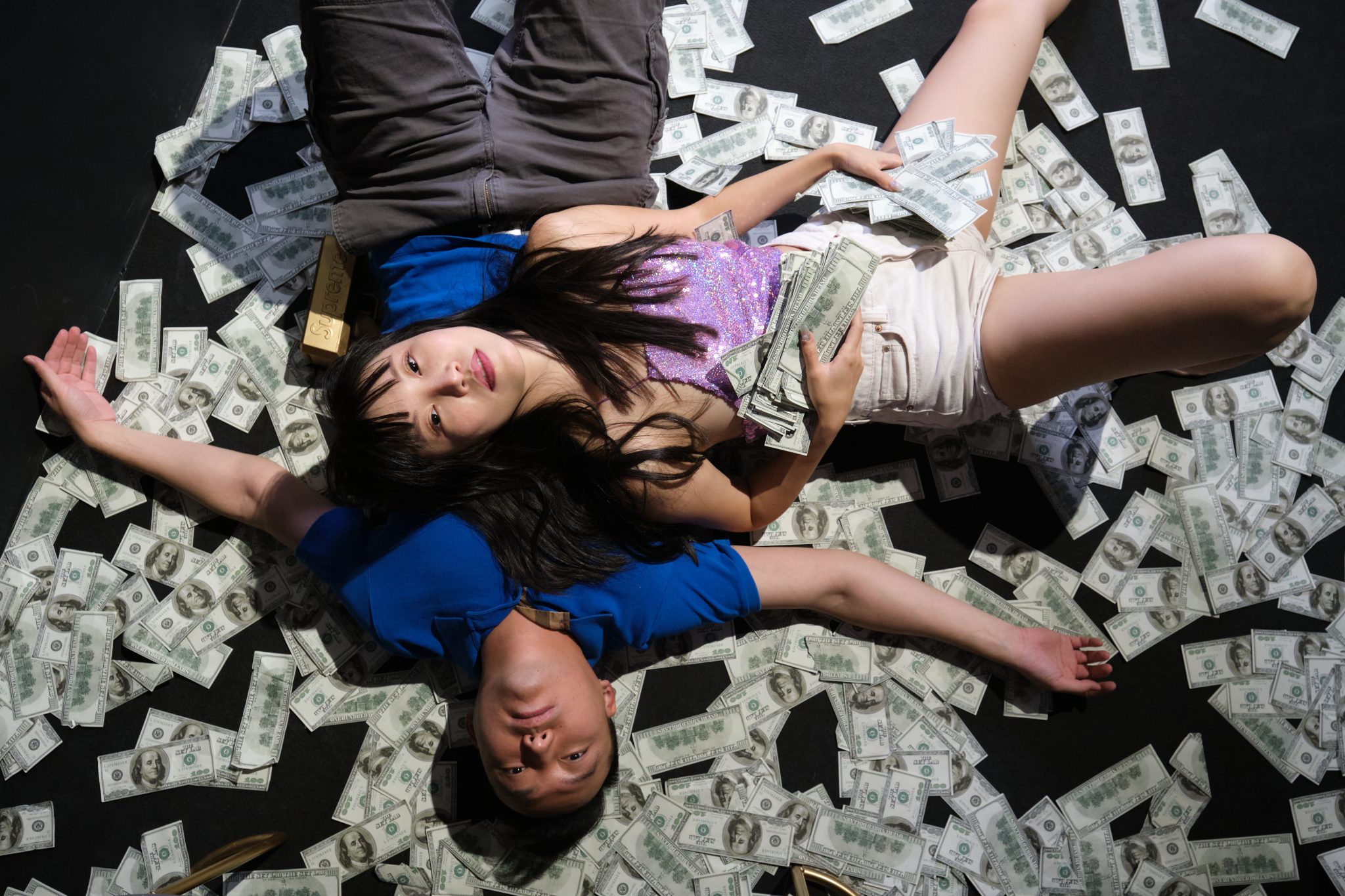 died young asian couple surrounded by dollar bills 2023 11 27 04 57 57 utc scaled
